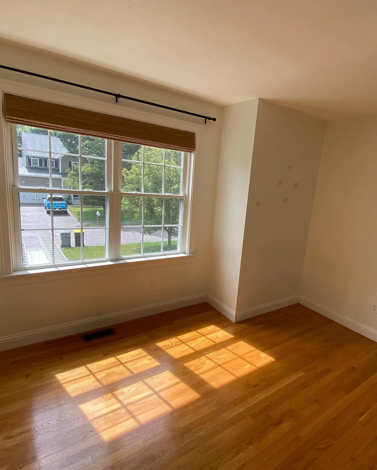Bright bedroom after interior painting in Framingham