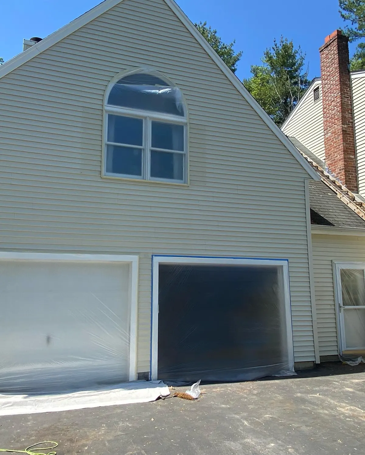 Sage house with two-car garage in Franklin after painting