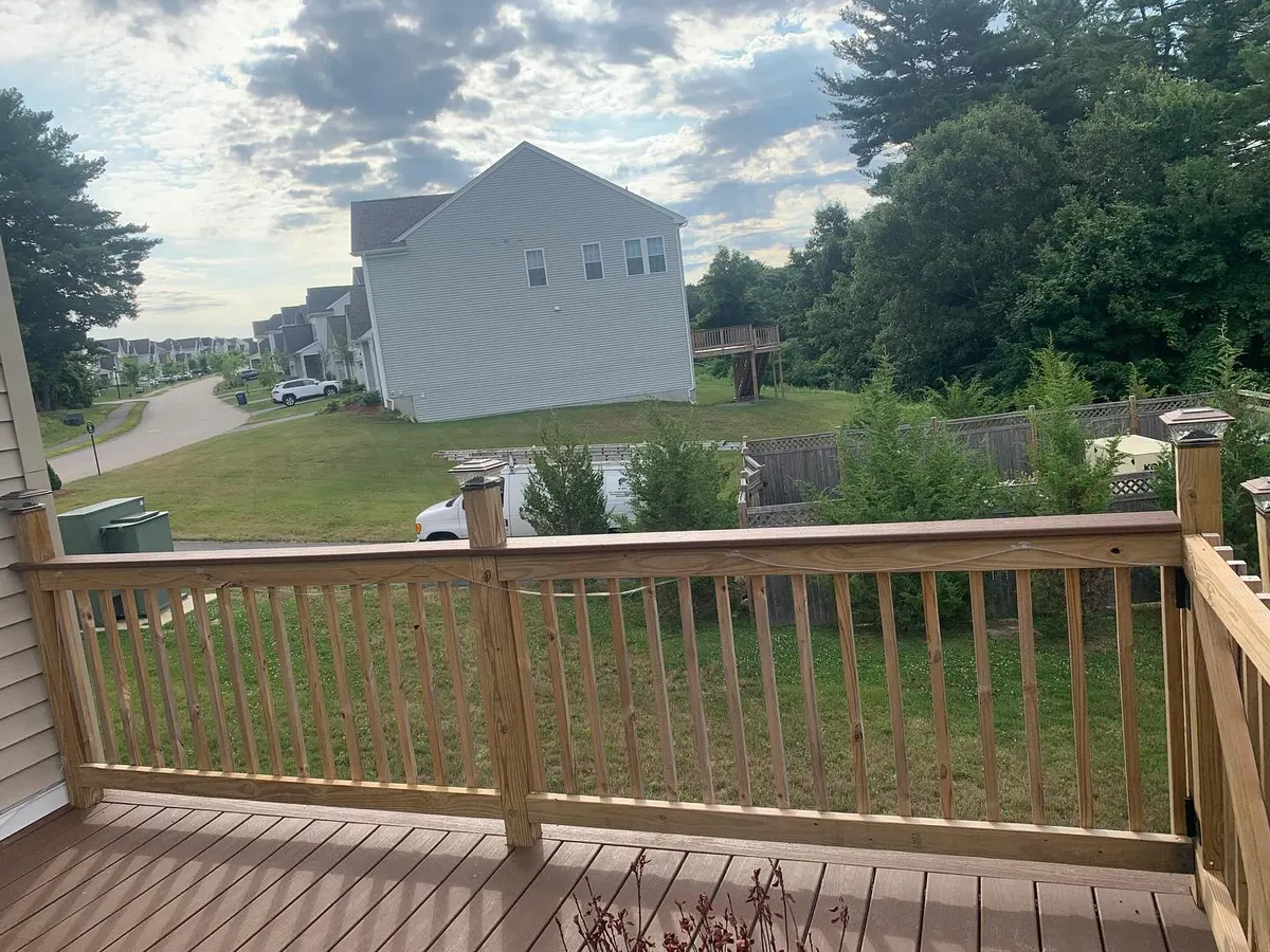 Deck with transparent red wood stain in Hopkinton
