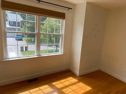 Freshly painted bedroom with hardwood floor